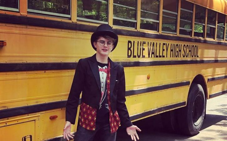 Wil Deusner infront of a School Bus